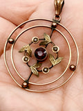 Edwardian 9k gold lavalier pendant with garnet and seed pearls
