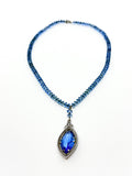 Art Deco blue glass pendant necklace strung on chain