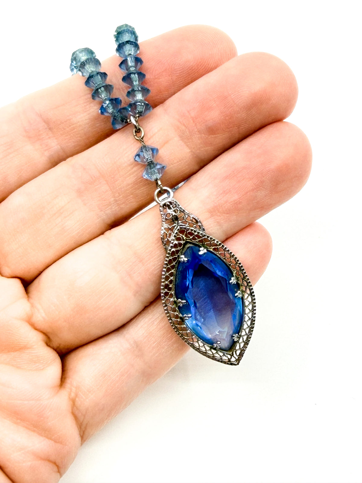 Art Deco blue glass pendant necklace strung on chain