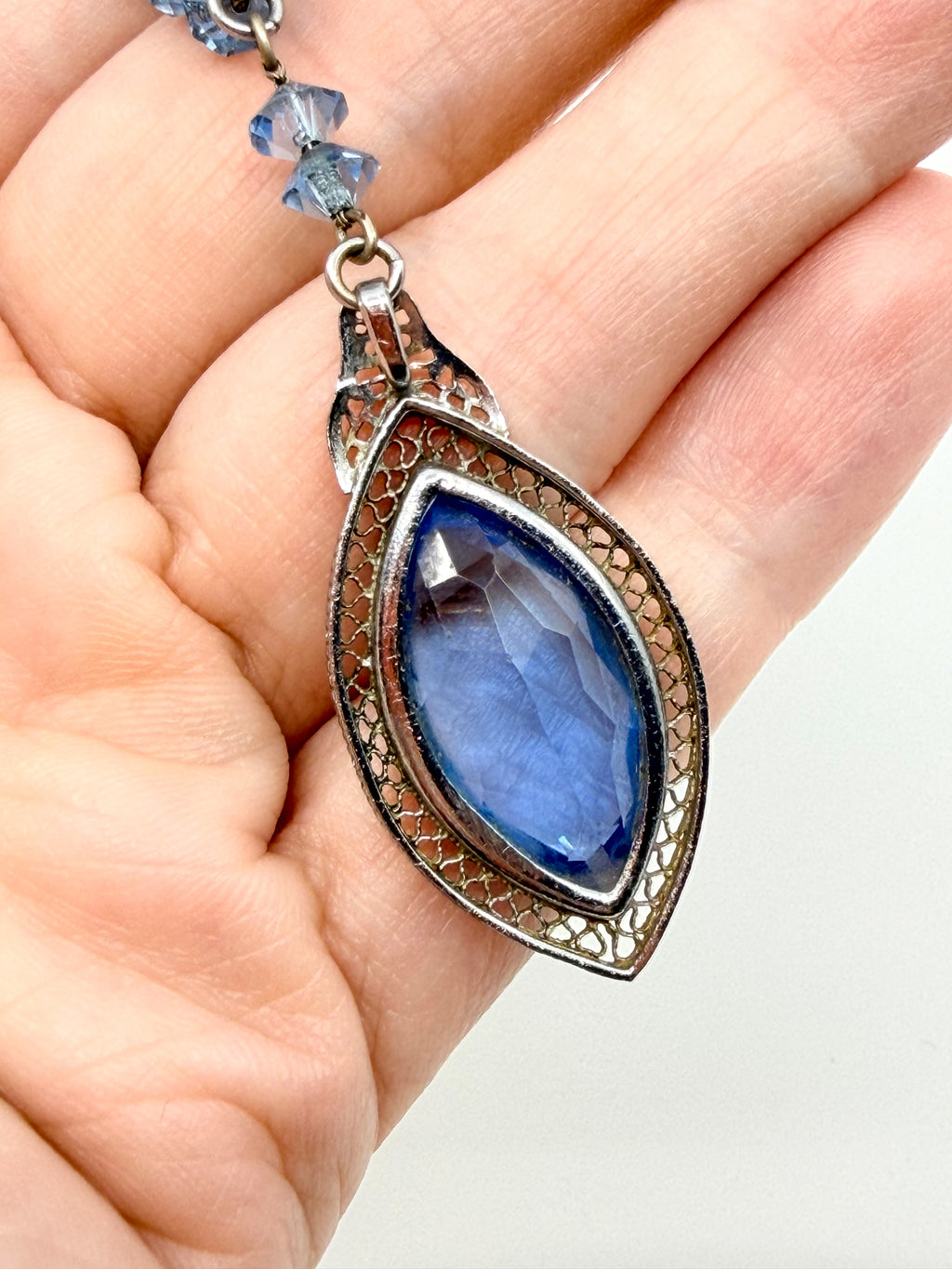 Art Deco blue glass pendant necklace strung on chain