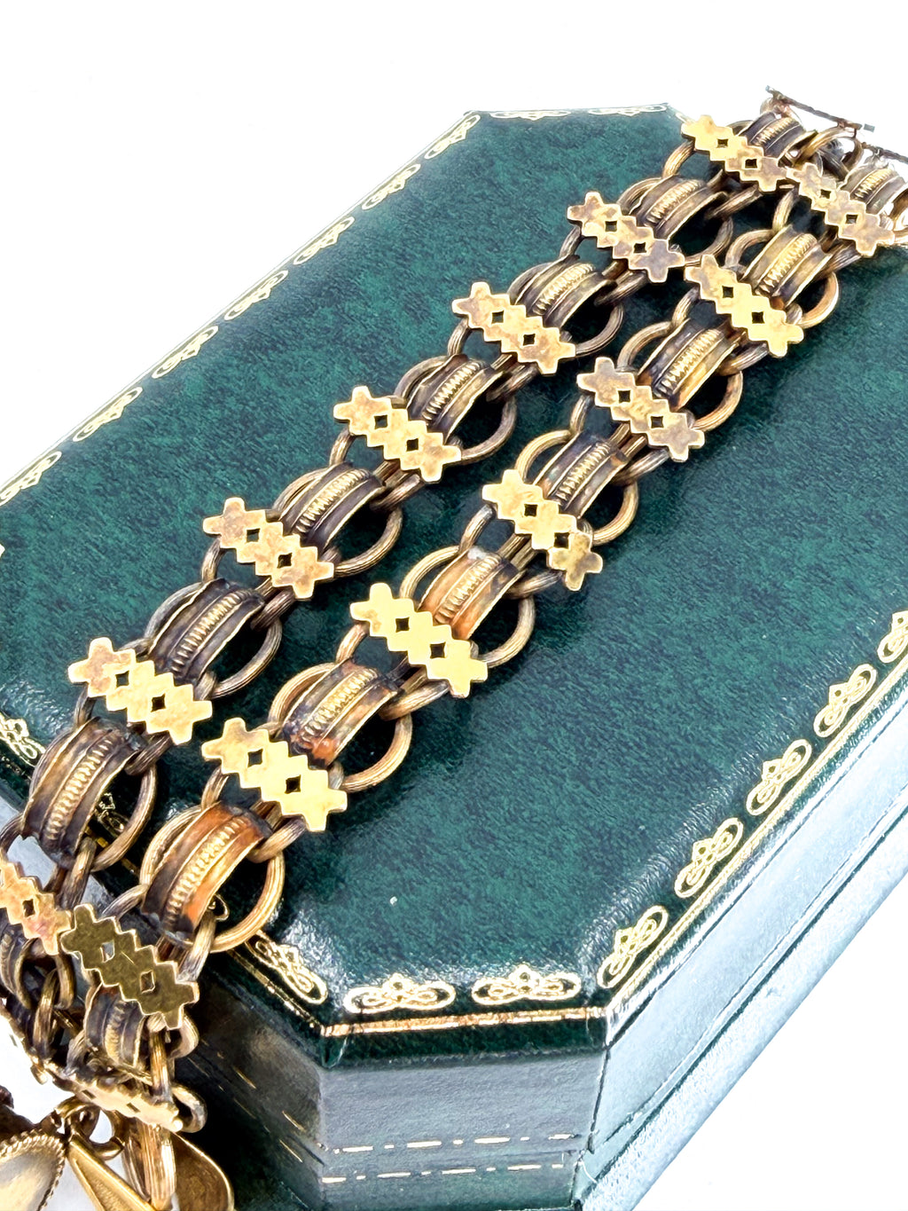 A close-up of the chain links on a Victorian book chain necklace