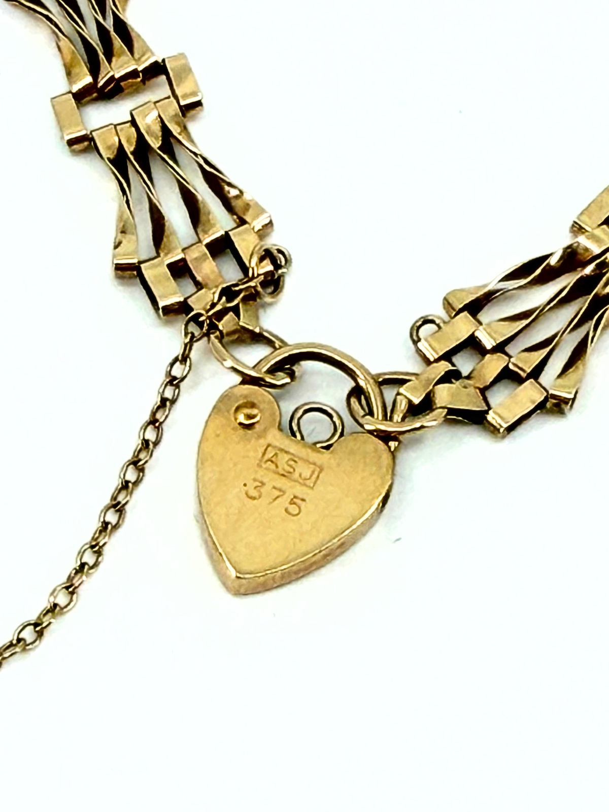 Vintage 9k gold gate bracelet with heart padlock charm