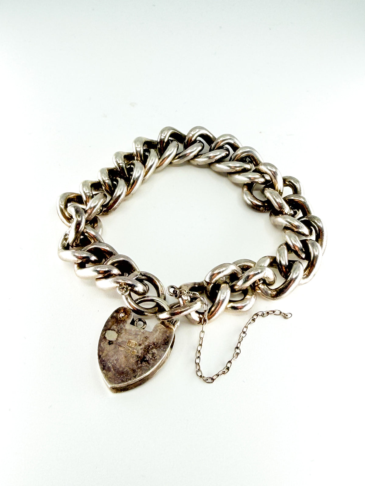 Heavy vintage sterling silver curb bracelet with padlock heart clasp