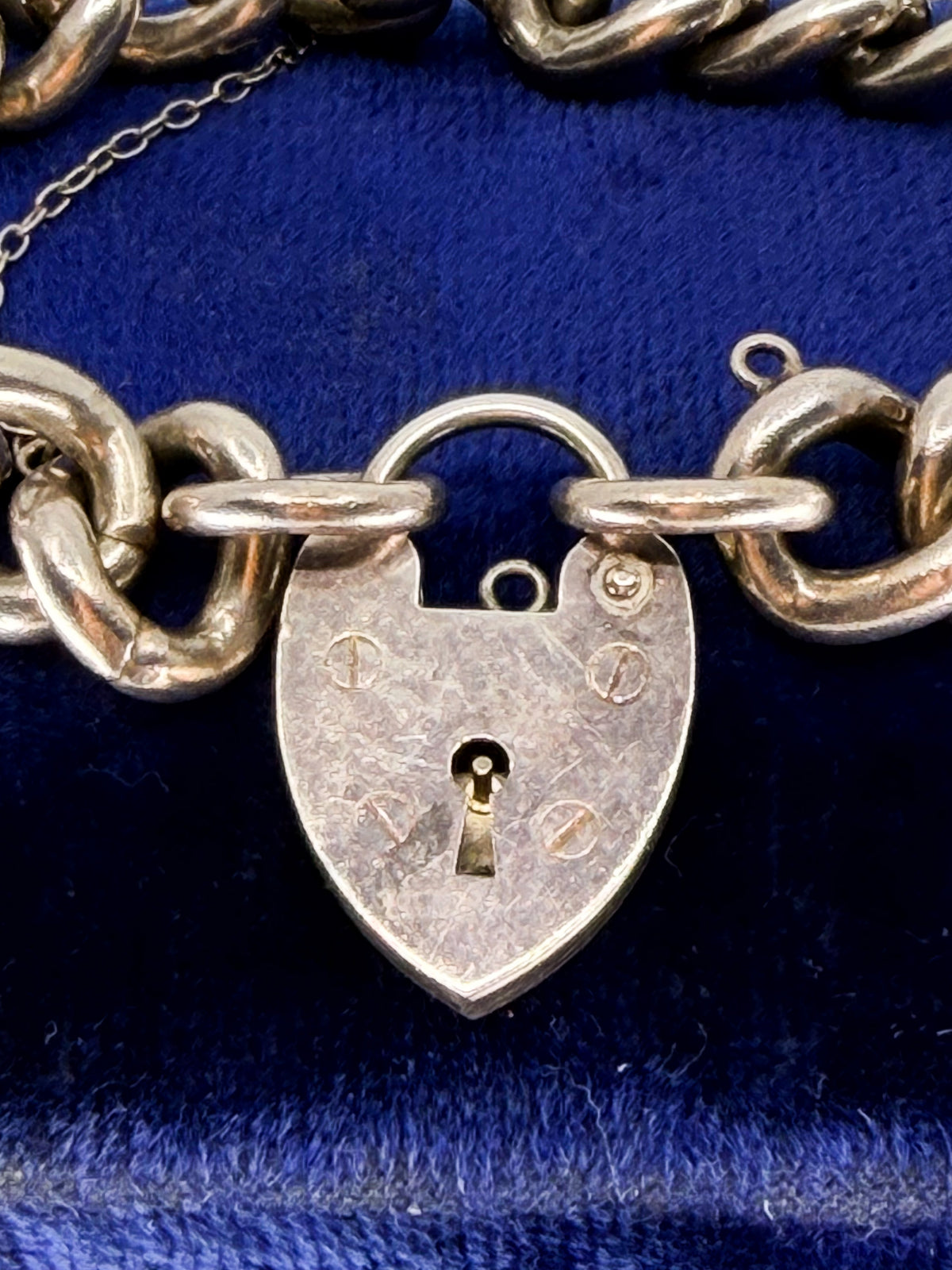 Heavy vintage sterling silver curb bracelet with padlock heart clasp