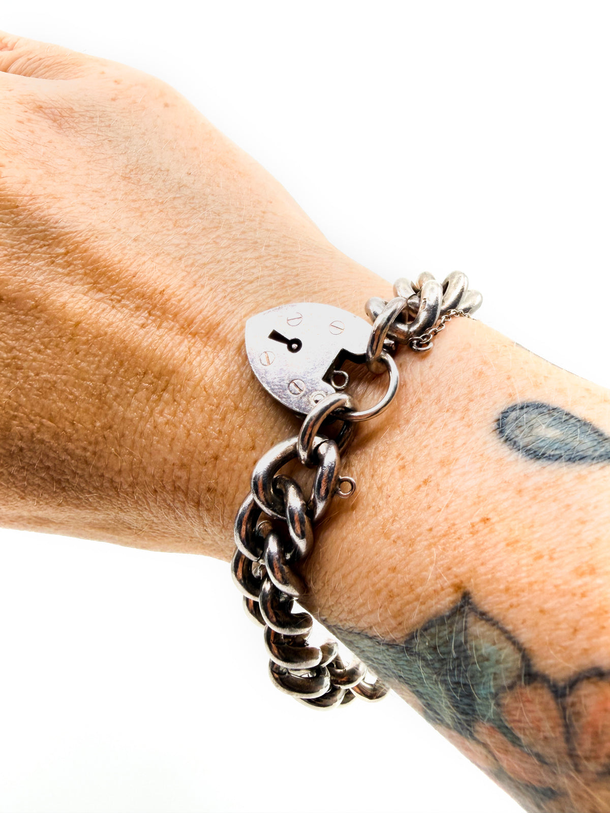 Heavy vintage sterling silver curb bracelet with padlock heart clasp