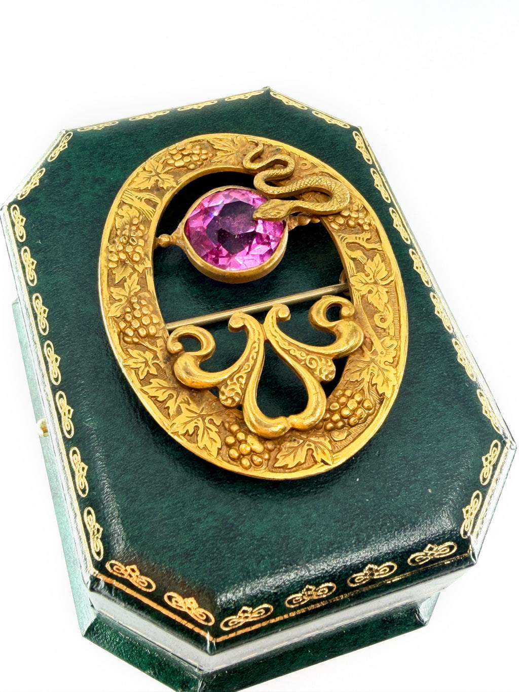 Art nouveau snake sash brooch with pink glass stone