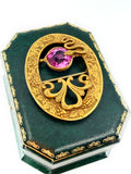Art nouveau snake sash brooch with pink glass stone