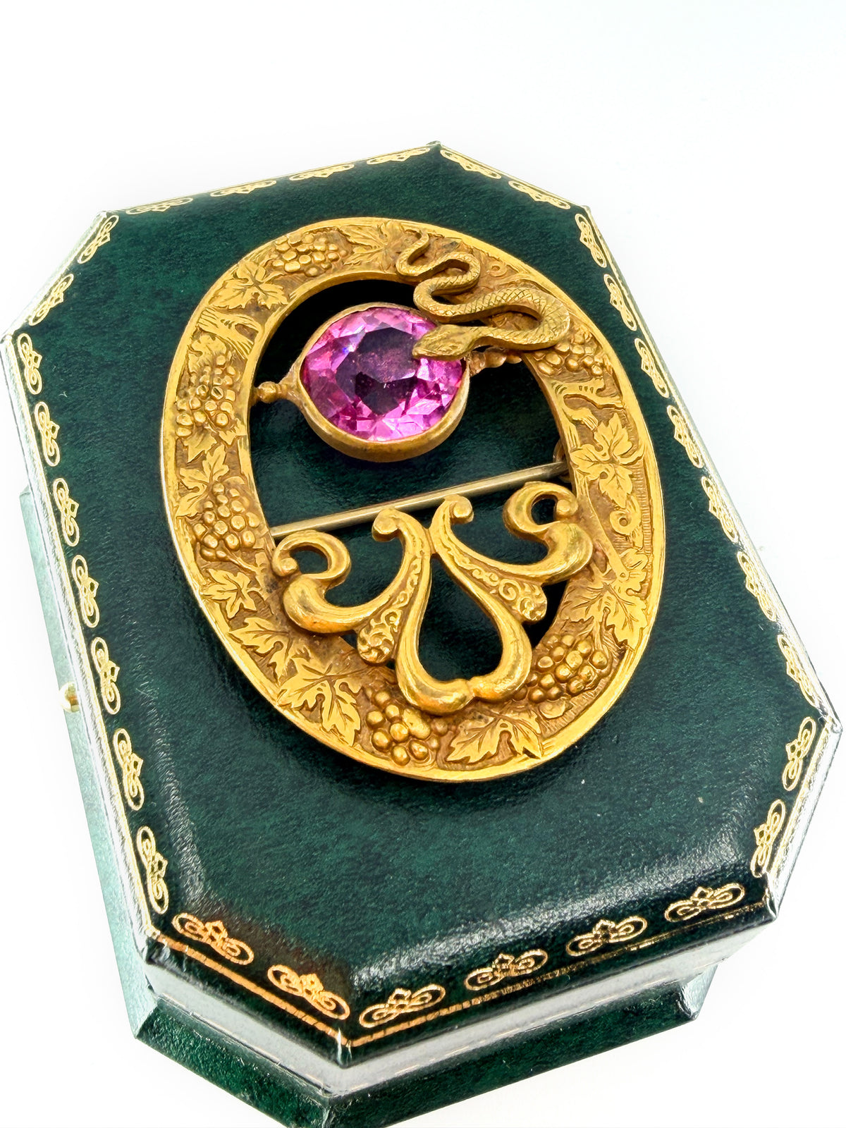 Art nouveau snake sash brooch with pink glass stone