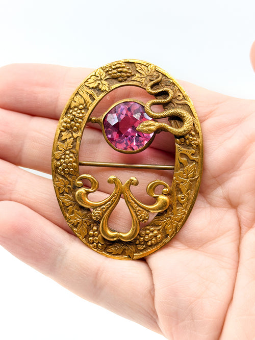 Art nouveau snake sash brooch with pink glass stone
