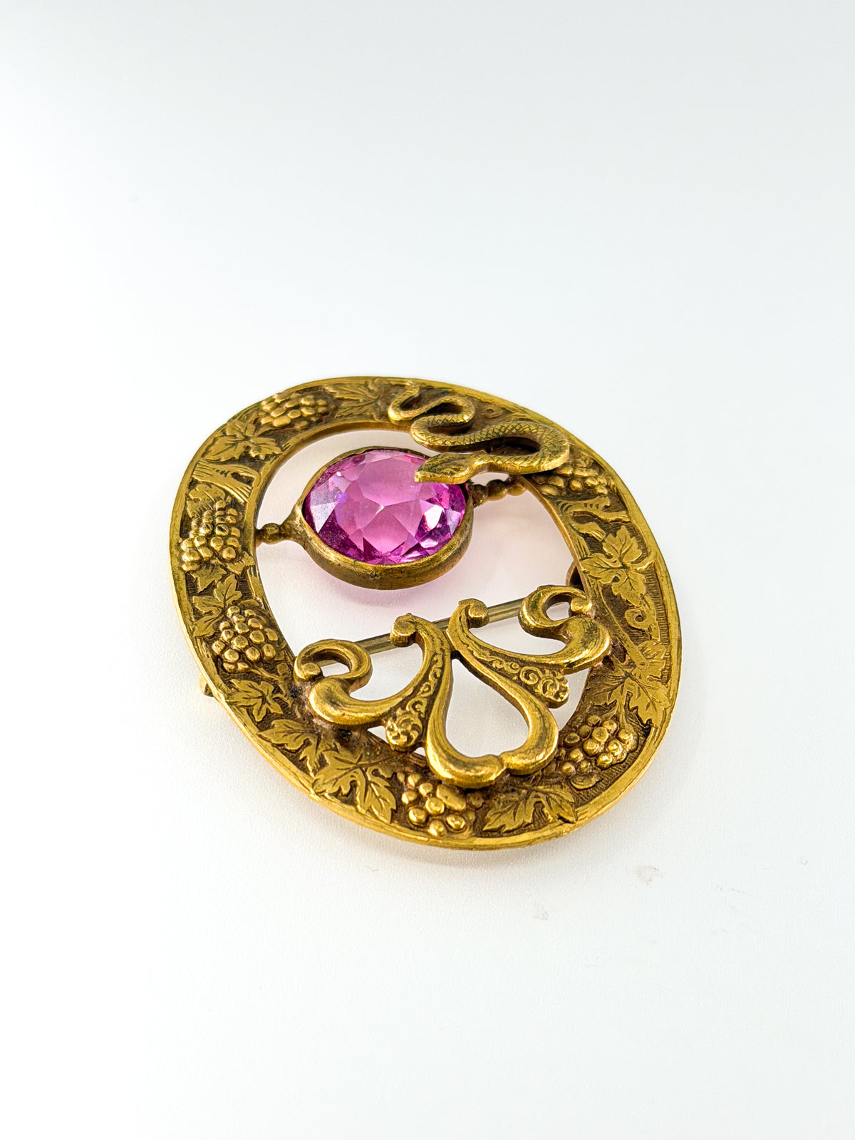 Art nouveau snake sash brooch with pink glass stone