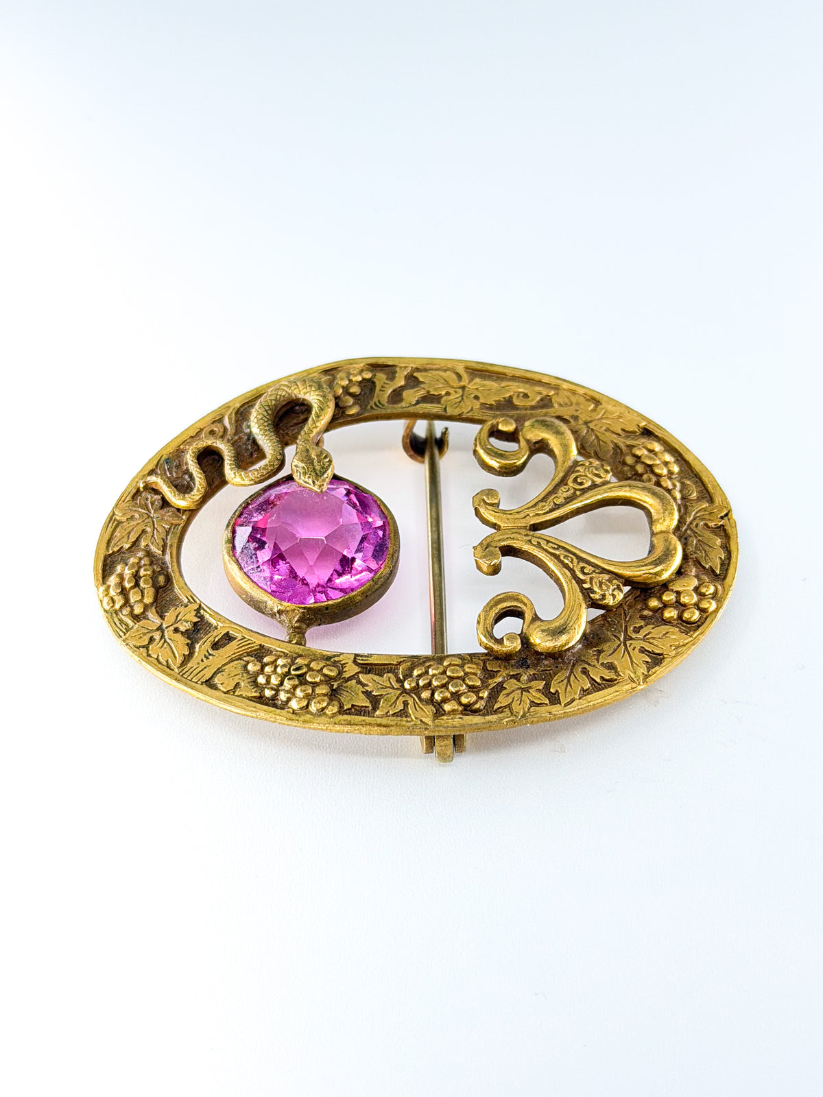 Art nouveau snake sash brooch with pink glass stone